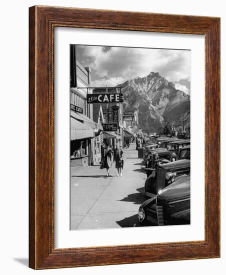 Pedestrians Walking Along Main Street in Resort Town with Cascade Mountain in the Background-Andreas Feininger-Framed Photographic Print