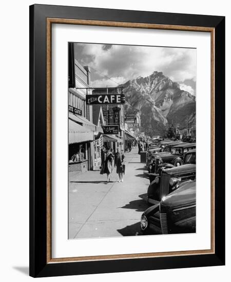 Pedestrians Walking Along Main Street in Resort Town with Cascade Mountain in the Background-Andreas Feininger-Framed Photographic Print