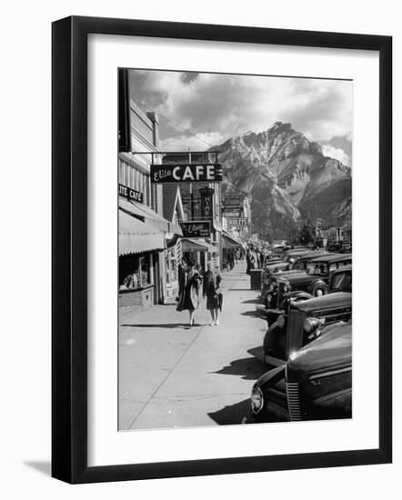 Pedestrians Walking Along Main Street in Resort Town with Cascade Mountain in the Background-Andreas Feininger-Framed Photographic Print