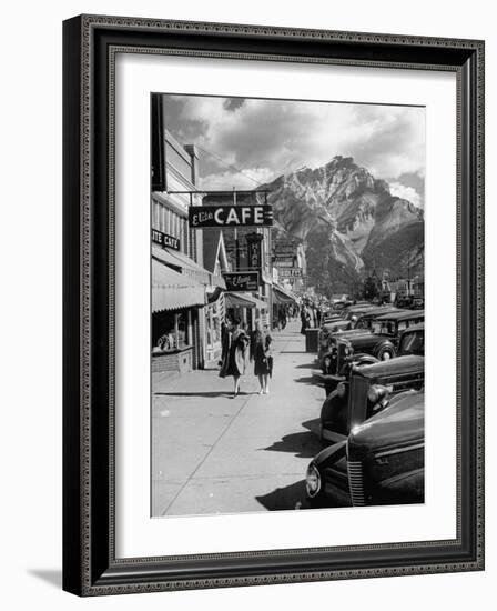 Pedestrians Walking Along Main Street in Resort Town with Cascade Mountain in the Background-Andreas Feininger-Framed Photographic Print