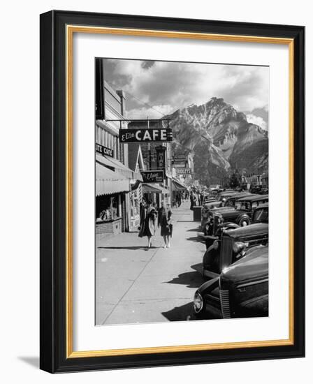 Pedestrians Walking Along Main Street in Resort Town with Cascade Mountain in the Background-Andreas Feininger-Framed Photographic Print