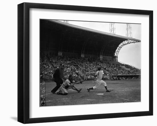 Pee Wee Reese Bats for the Brooklyn Dodgers During a Dodgers-Braves Game at Miami Stadium-null-Framed Photographic Print