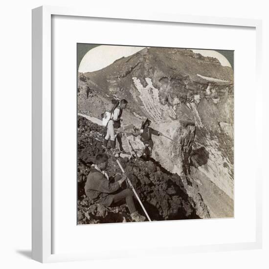 Peering from the Lava Encrusted Rim Down into Mount Fuji's (Fujiyama) Crater, Japan, 1904-Underwood & Underwood-Framed Photographic Print