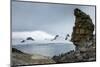 Penguins below dramatic rock formations, Half Moon Bay, South Sheltand Islands, Antarctica, Polar R-Michael Runkel-Mounted Photographic Print