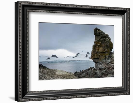 Penguins below dramatic rock formations, Half Moon Bay, South Sheltand Islands, Antarctica, Polar R-Michael Runkel-Framed Photographic Print