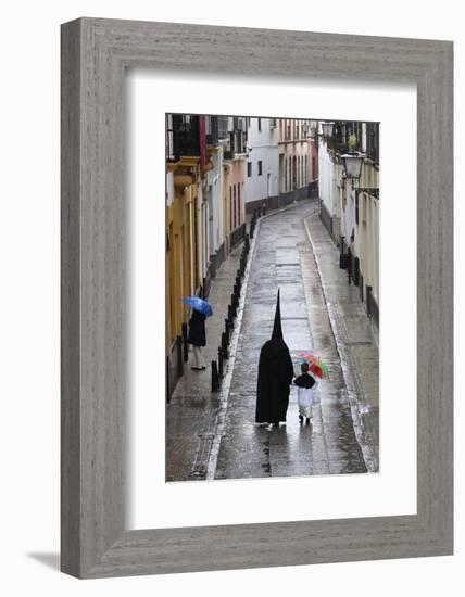 Penitents During Semana Santa (Holy Week) Along Rainy Street, Seville, Andalucia, Spain, Europe-Stuart Black-Framed Photographic Print