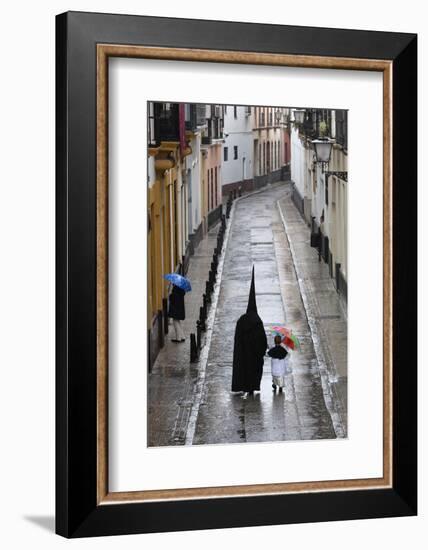 Penitents During Semana Santa (Holy Week) Along Rainy Street, Seville, Andalucia, Spain, Europe-Stuart Black-Framed Photographic Print