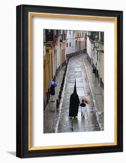 Penitents During Semana Santa (Holy Week) Along Rainy Street, Seville, Andalucia, Spain, Europe-Stuart Black-Framed Photographic Print