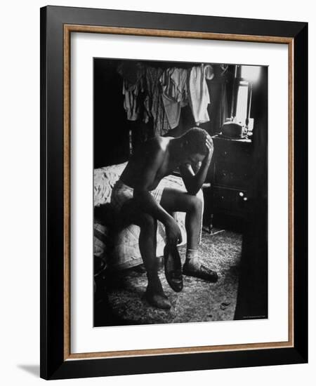 Pensive Portrait of Young African American Alone in His Room from Youth Essay-Gordon Parks-Framed Photographic Print
