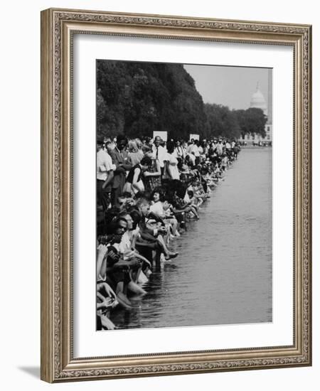 People at Civil Rights Rally Soaking their Feet in the Reflecting Pool at the Washington Monument-John Dominis-Framed Photographic Print