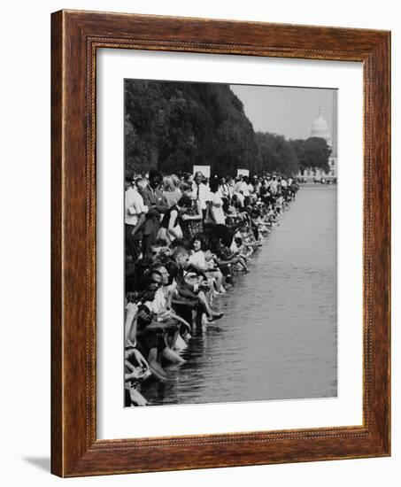 People at Civil Rights Rally Soaking their Feet in the Reflecting Pool at the Washington Monument-John Dominis-Framed Photographic Print