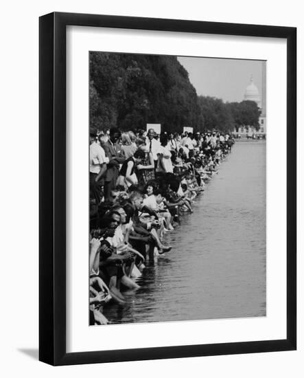 People at Civil Rights Rally Soaking their Feet in the Reflecting Pool at the Washington Monument-John Dominis-Framed Photographic Print