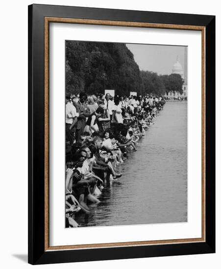 People at Civil Rights Rally Soaking their Feet in the Reflecting Pool at the Washington Monument-John Dominis-Framed Photographic Print