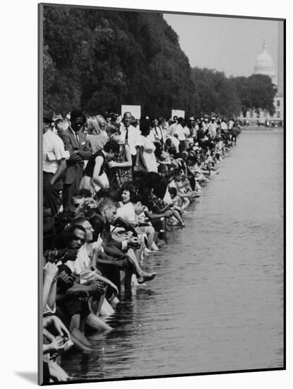 People at Civil Rights Rally Soaking their Feet in the Reflecting Pool at the Washington Monument-John Dominis-Mounted Photographic Print
