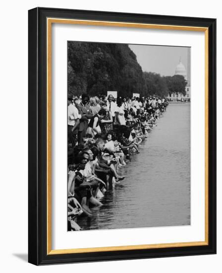 People at Civil Rights Rally Soaking their Feet in the Reflecting Pool at the Washington Monument-John Dominis-Framed Photographic Print