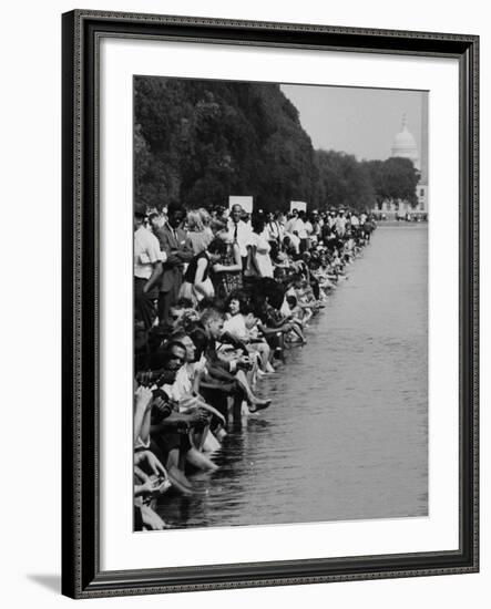 People at Civil Rights Rally Soaking their Feet in the Reflecting Pool at the Washington Monument-John Dominis-Framed Photographic Print