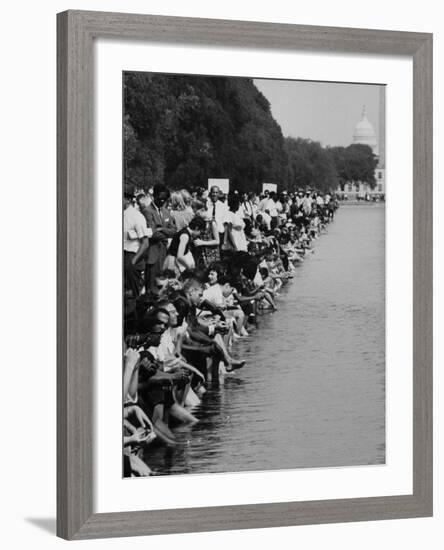 People at Civil Rights Rally Soaking their Feet in the Reflecting Pool at the Washington Monument-John Dominis-Framed Photographic Print