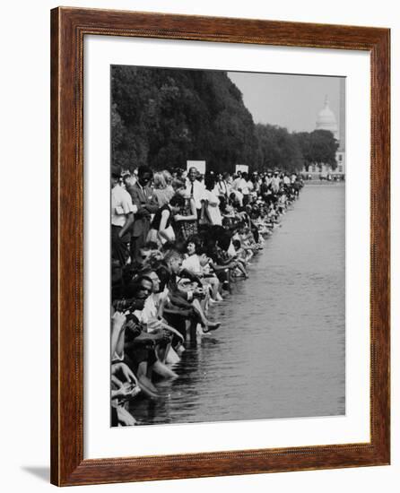 People at Civil Rights Rally Soaking their Feet in the Reflecting Pool at the Washington Monument-John Dominis-Framed Photographic Print