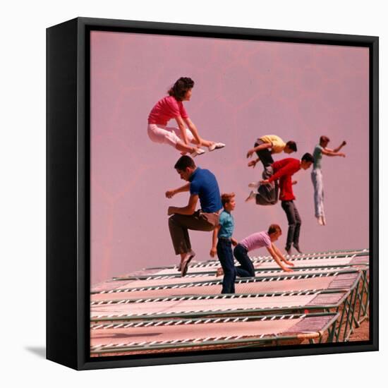 People Bouncing on Trampolines at Trampoline Center-J^ R^ Eyerman-Framed Premier Image Canvas