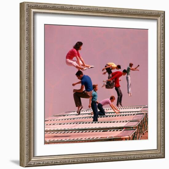 People Bouncing on Trampolines at Trampoline Center-J^ R^ Eyerman-Framed Photographic Print