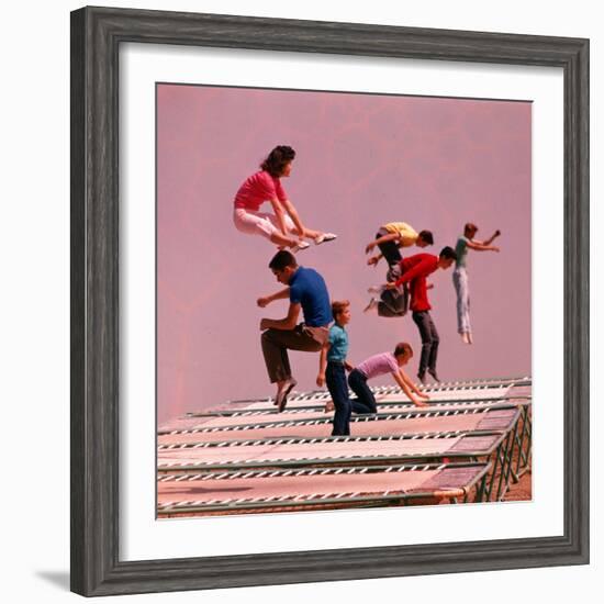 People Bouncing on Trampolines at Trampoline Center-J^ R^ Eyerman-Framed Photographic Print