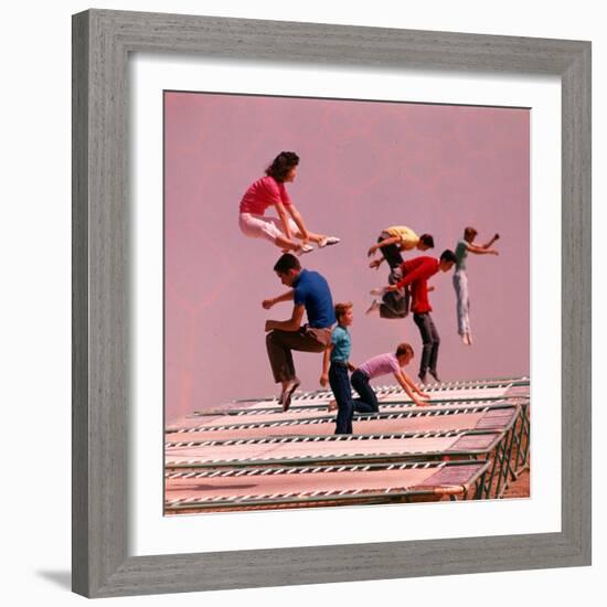 People Bouncing on Trampolines at Trampoline Center-J^ R^ Eyerman-Framed Photographic Print