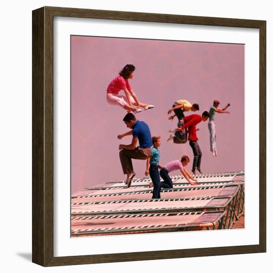 People Bouncing on Trampolines at Trampoline Center-J^ R^ Eyerman-Framed Photographic Print