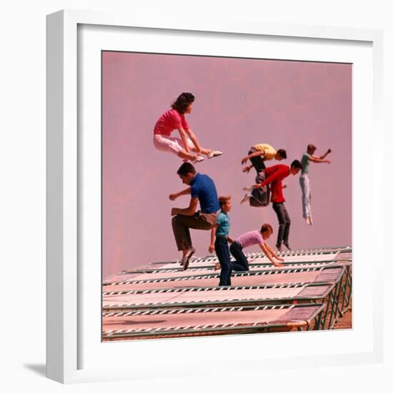 People Bouncing on Trampolines at Trampoline Center-J^ R^ Eyerman-Framed Photographic Print