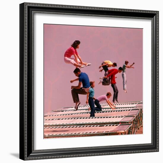 People Bouncing on Trampolines at Trampoline Center-J^ R^ Eyerman-Framed Photographic Print