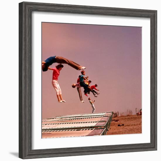 People Bouncing on Trampolines at Trampoline Center-J^ R^ Eyerman-Framed Photographic Print