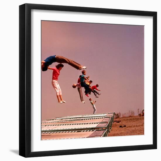 People Bouncing on Trampolines at Trampoline Center-J^ R^ Eyerman-Framed Photographic Print