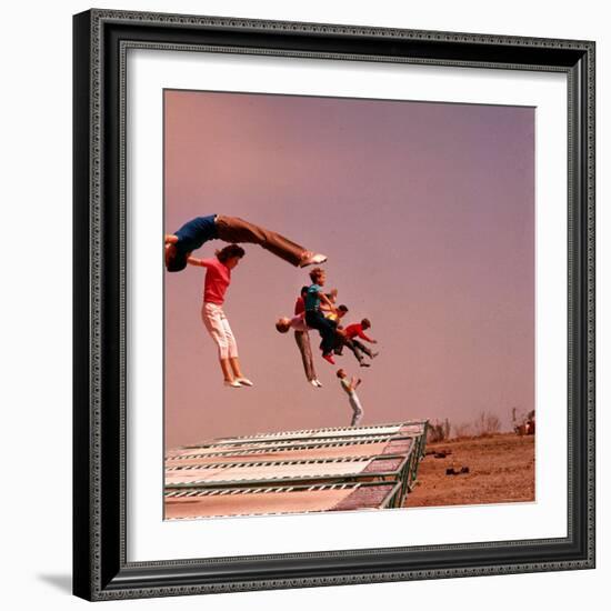 People Bouncing on Trampolines at Trampoline Center-J^ R^ Eyerman-Framed Photographic Print