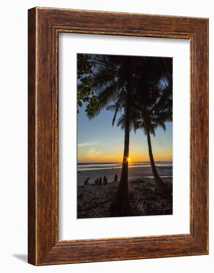 People by Palm Trees at Sunset on Playa Hermosa Beach, Santa Teresa, Costa Rica-Rob Francis-Framed Photographic Print