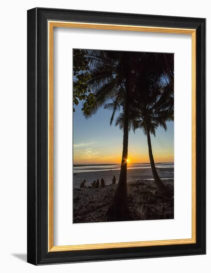 People by Palm Trees at Sunset on Playa Hermosa Beach, Santa Teresa, Costa Rica-Rob Francis-Framed Photographic Print