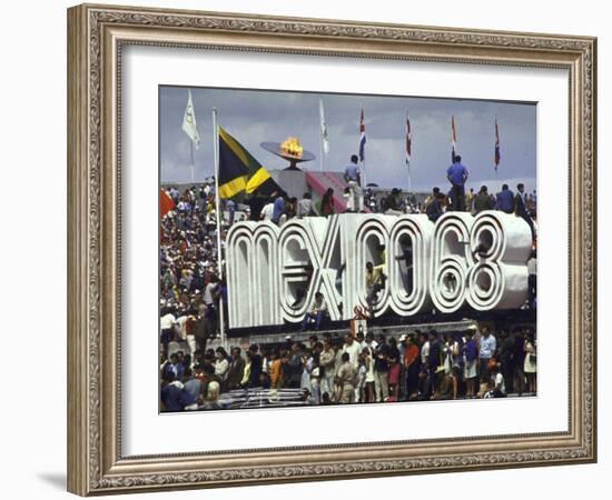 People Climbing and Sitting on a Mexico '68 Sign at the Summer Olympics-John Dominis-Framed Photographic Print