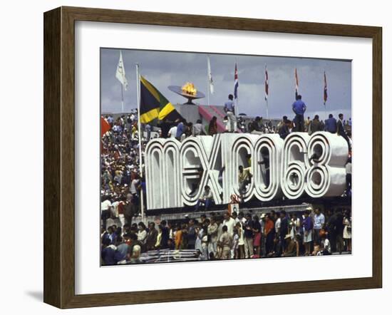 People Climbing and Sitting on a Mexico '68 Sign at the Summer Olympics-John Dominis-Framed Photographic Print