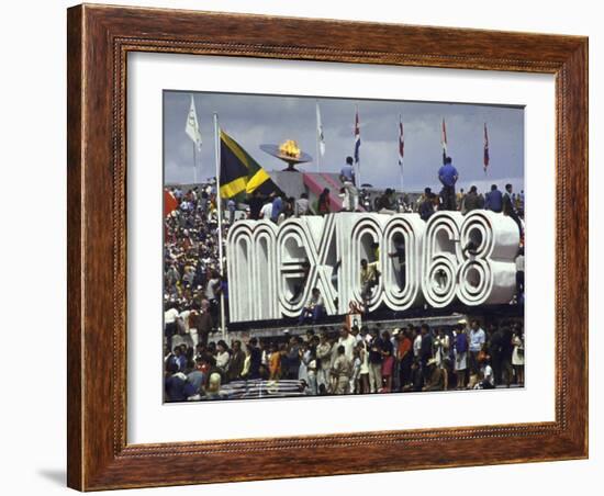 People Climbing and Sitting on a Mexico '68 Sign at the Summer Olympics-John Dominis-Framed Photographic Print