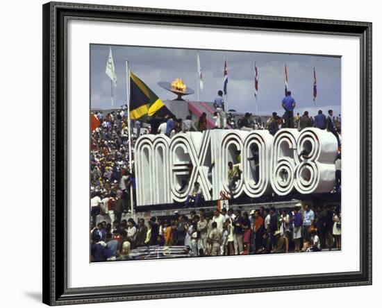 People Climbing and Sitting on a Mexico '68 Sign at the Summer Olympics-John Dominis-Framed Photographic Print