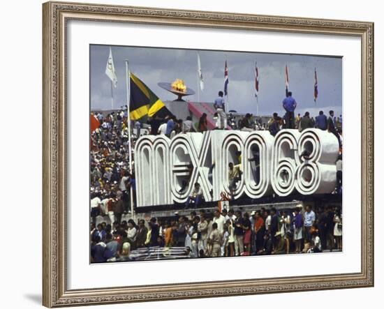 People Climbing and Sitting on a Mexico '68 Sign at the Summer Olympics-John Dominis-Framed Photographic Print