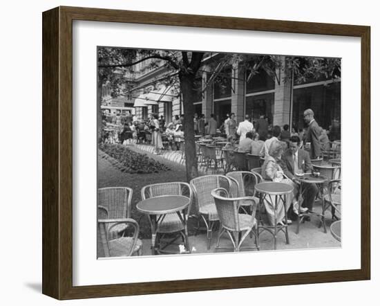 People Eating at a Sidewalk Cafe Next to the Excelsior Hotel-Dmitri Kessel-Framed Photographic Print