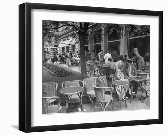 People Eating at a Sidewalk Cafe Next to the Excelsior Hotel-Dmitri Kessel-Framed Photographic Print