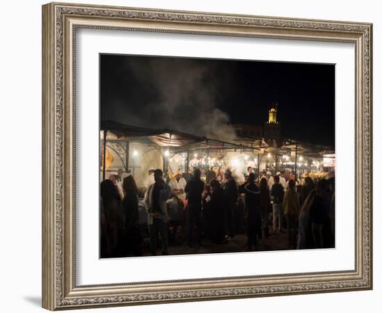 People eating at one of the stalls in Jemaa el-Fna at night, Marrakesh, Morocco-null-Framed Photographic Print