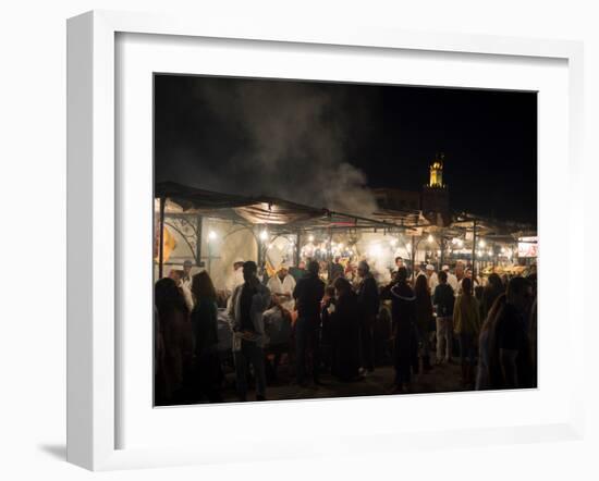 People eating at one of the stalls in Jemaa el-Fna at night, Marrakesh, Morocco-null-Framed Photographic Print