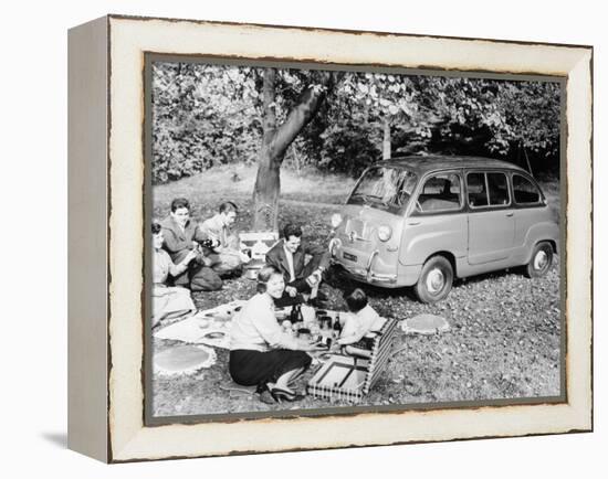 People Enjoying a Picnic Beside a 1956 Fiat 600 Multipla, (C1956)-null-Framed Premier Image Canvas