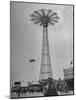 People Enjoying a Ride at Coney Island Amusement Park-Ed Clark-Mounted Photographic Print