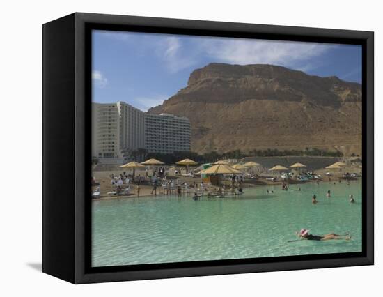 People Floating in the Sea and Hyatt Hotel and Desert Cliffs in Background, Dead Sea, Middle East-Eitan Simanor-Framed Premier Image Canvas