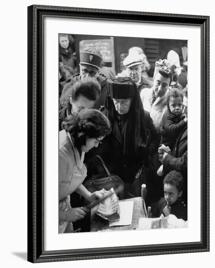 People in a Meat Store Watching Butcher Cut Meat-Yale Joel-Framed Premium Photographic Print