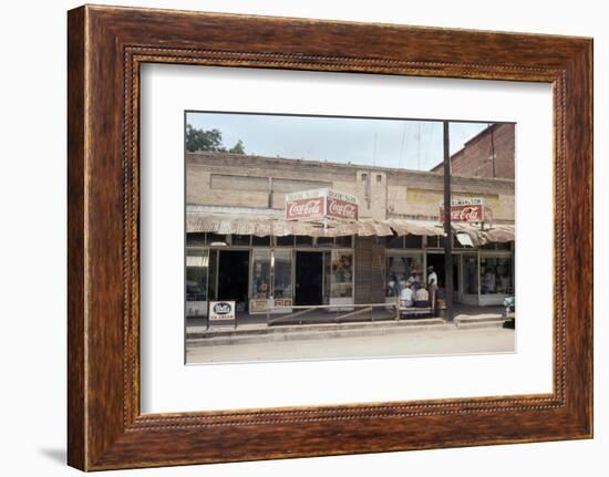 People in Front of Shops and under Metal Awning on Edisto Island, South Carolina, 1956-Walter Sanders-Framed Photographic Print