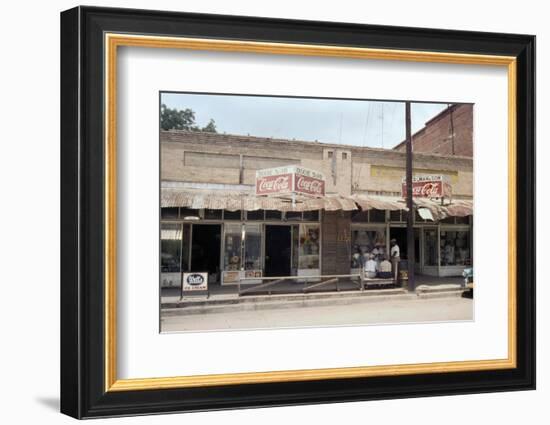 People in Front of Shops and under Metal Awning on Edisto Island, South Carolina, 1956-Walter Sanders-Framed Photographic Print