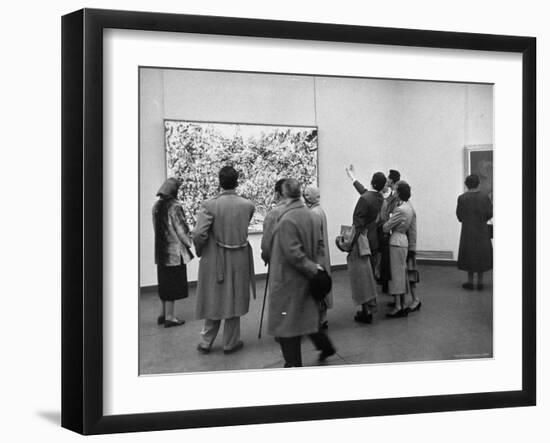 People Looking at a Painting by Artist Jackson Pollack at an American Art Show-Frank Scherschel-Framed Photographic Print